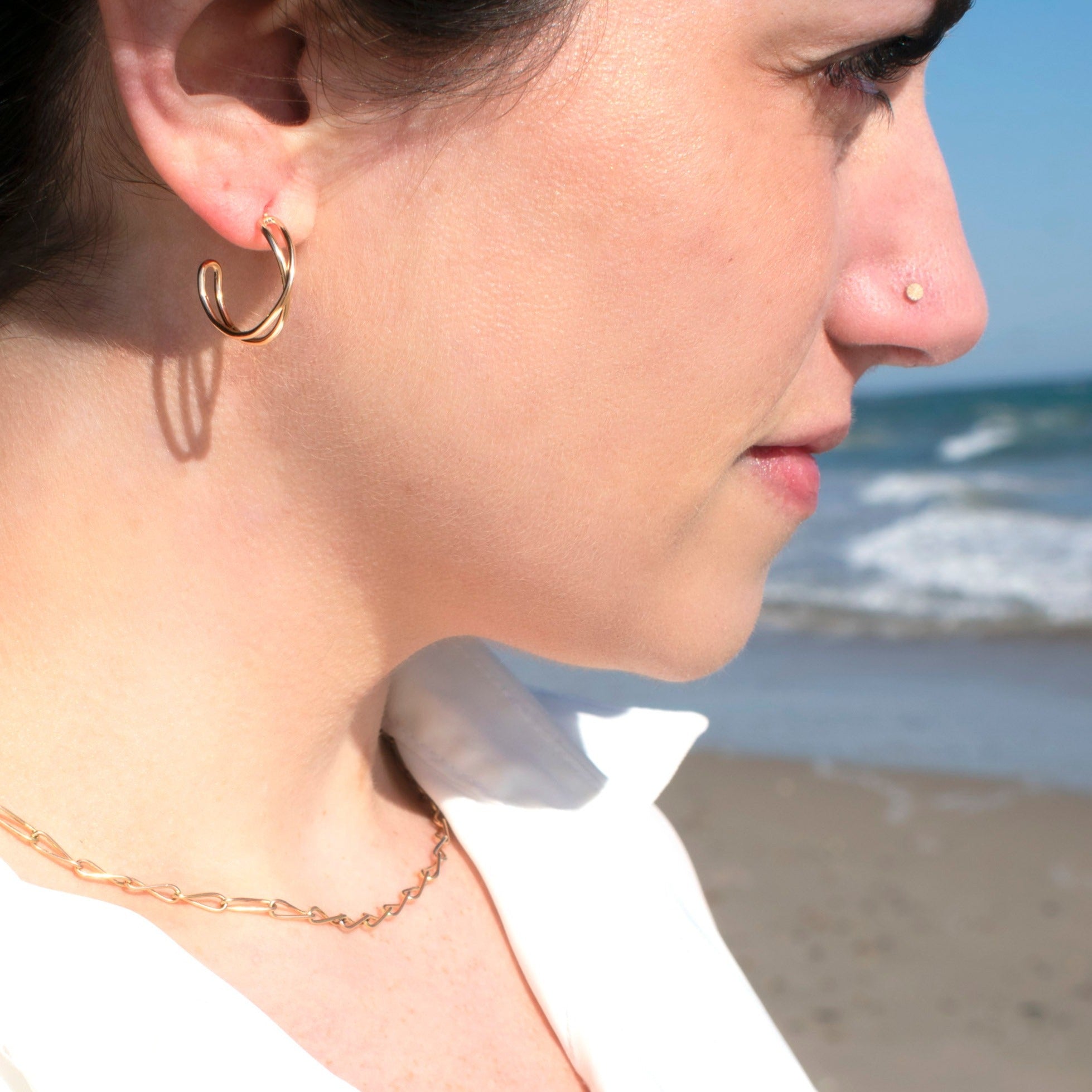 matching hoop and necklace set in gold on model