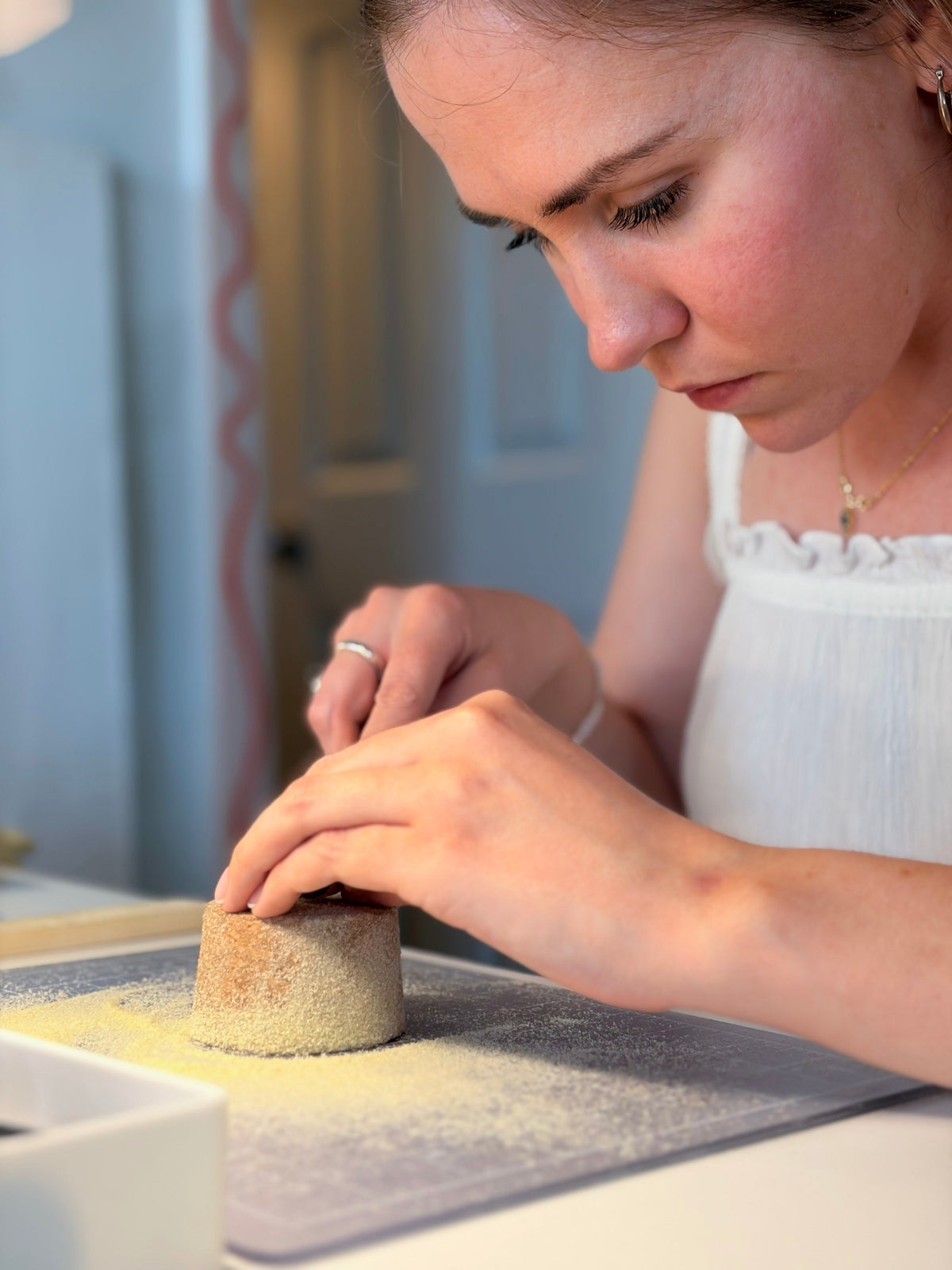 Participant carving a wax wedding band during a private RA HA studio session