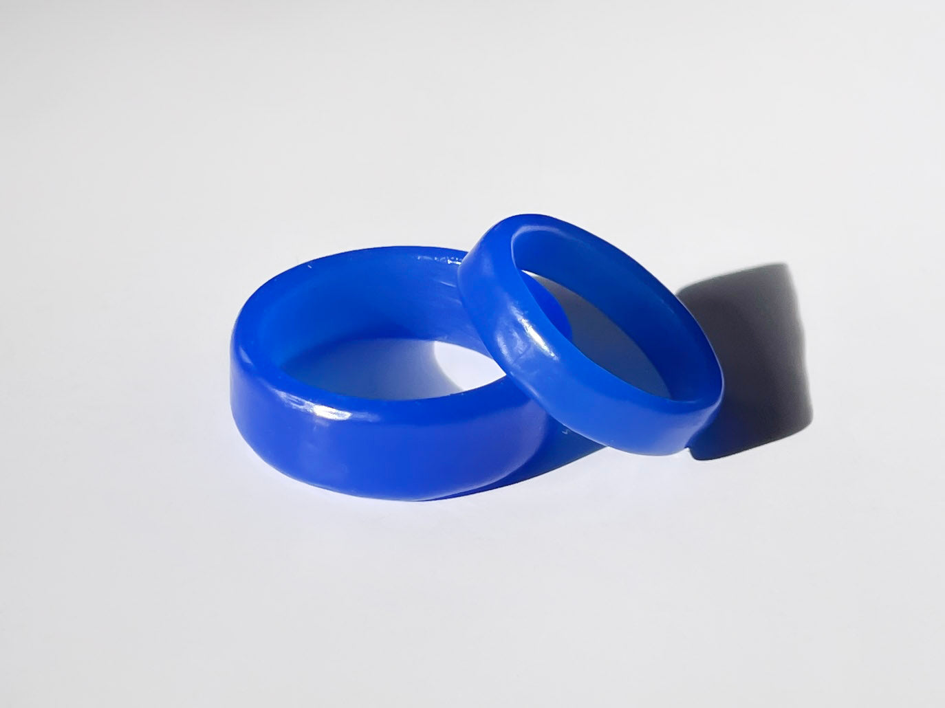 two custom blue wax wedding band prototypes made by hand