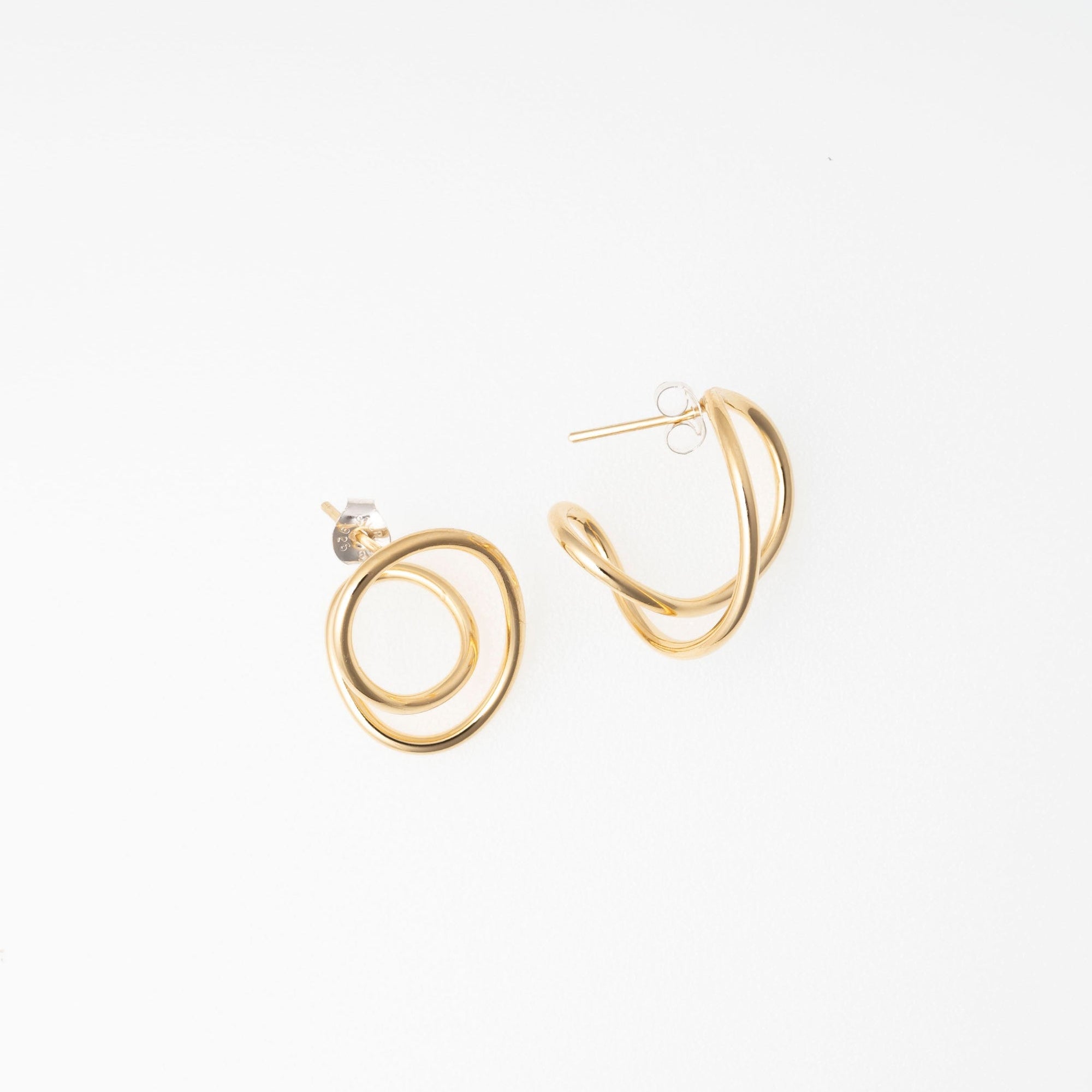 Gold hoop earrings on a white background