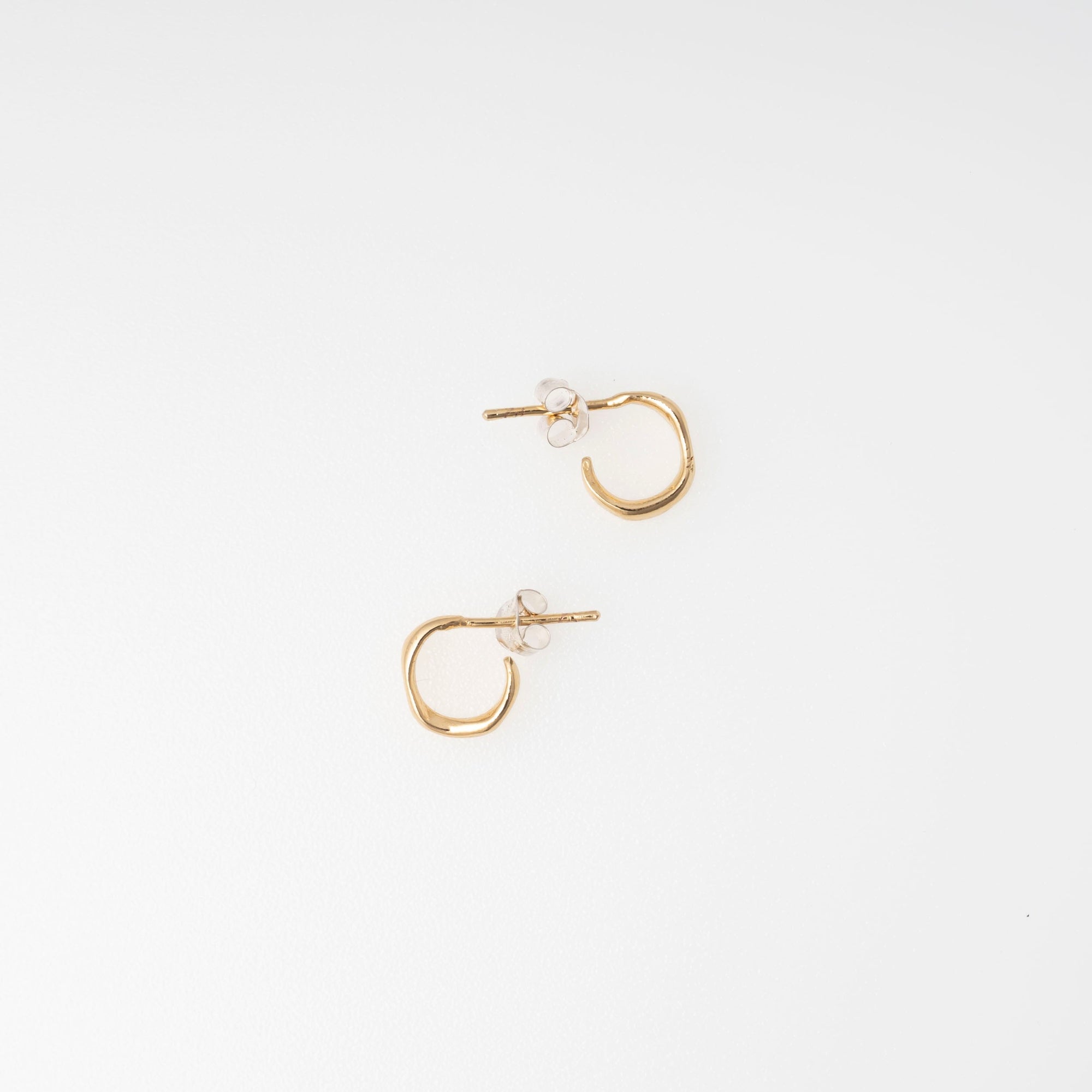 Gold hoop earrings  on a white background