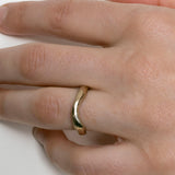 Hand-carved curved gold wedding band with organic profile