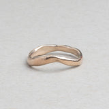 Curved sculptural 14k gold wedding band by RA HA Jewelry