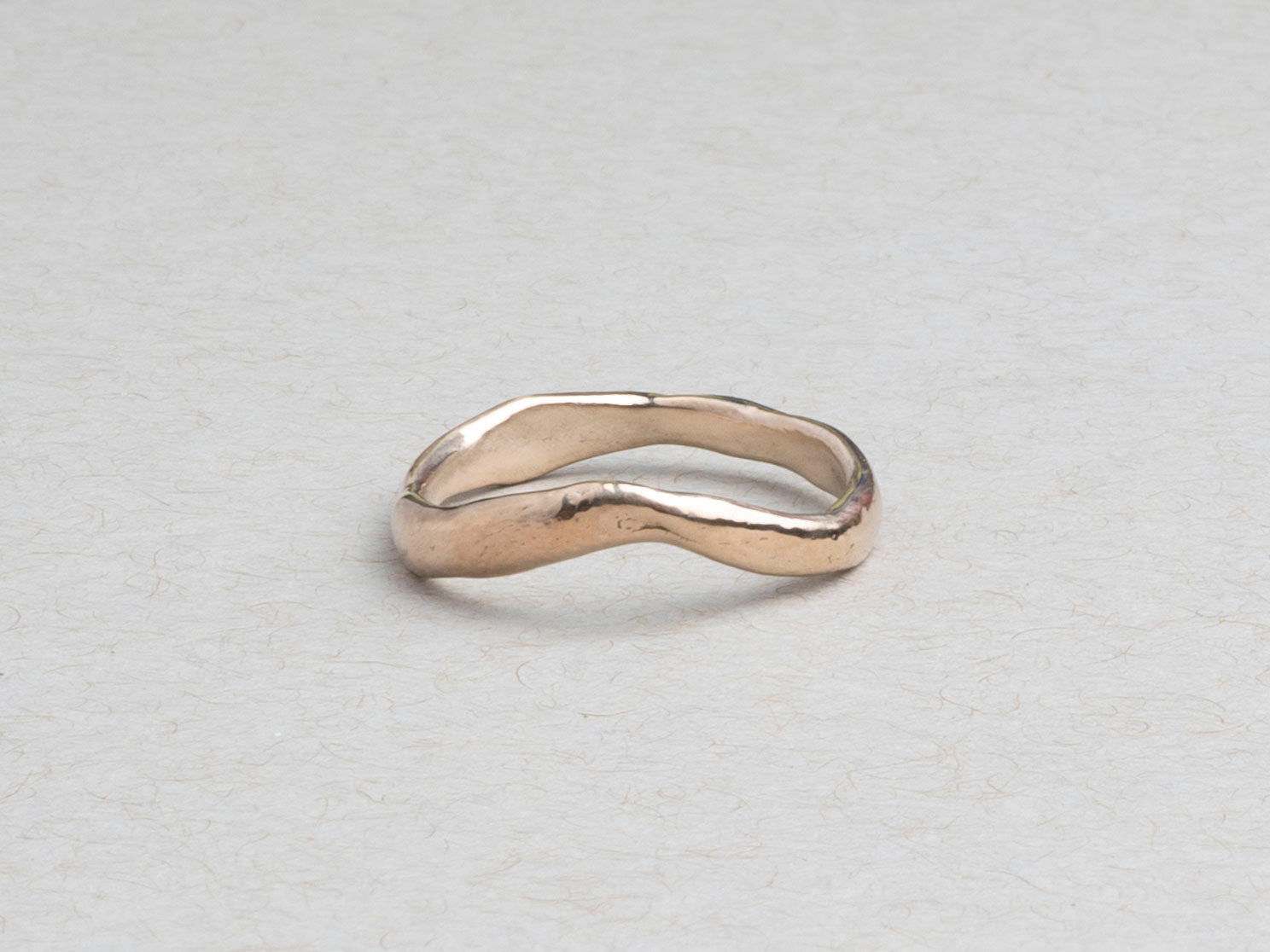 Curved sculptural 14k gold wedding band by RA HA Jewelry