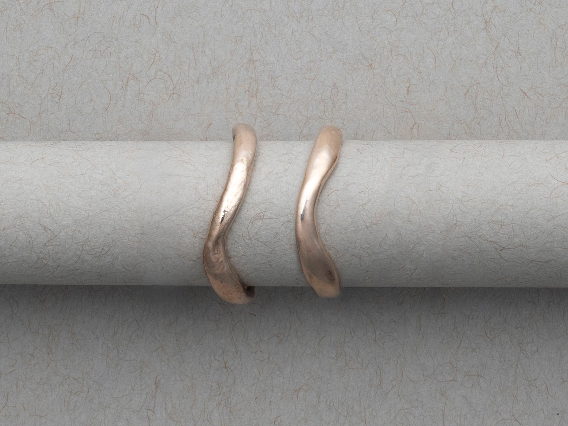 Smooth and textured curved gold wedding bands