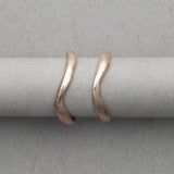 Smooth and textured curved gold wedding bands