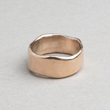 Substantial sculptural gold wedding band designed for everyday wear