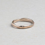 Thin hand-carved 14k gold wedding band