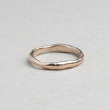 Thin hand-carved 14k gold wedding band