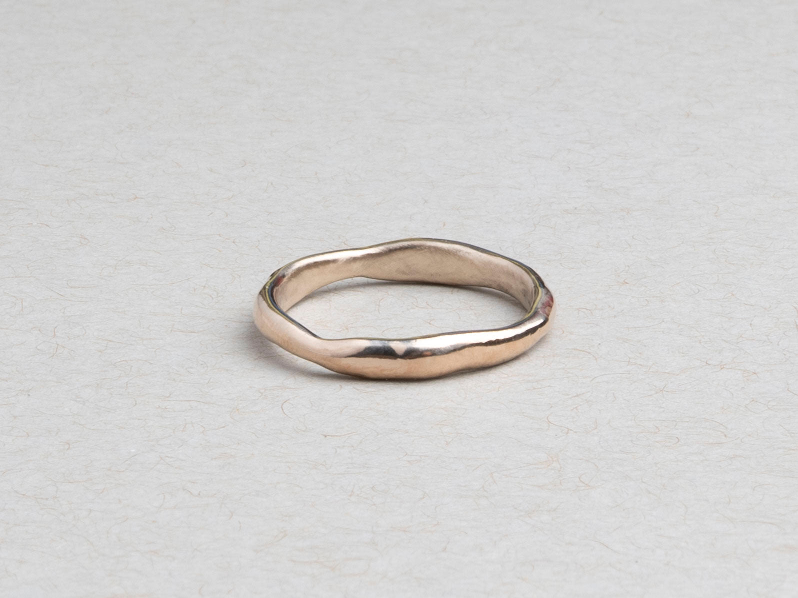 Thin hand-carved 14k gold wedding band