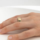 Thick hand-carved gold wedding band with textural organic finish
