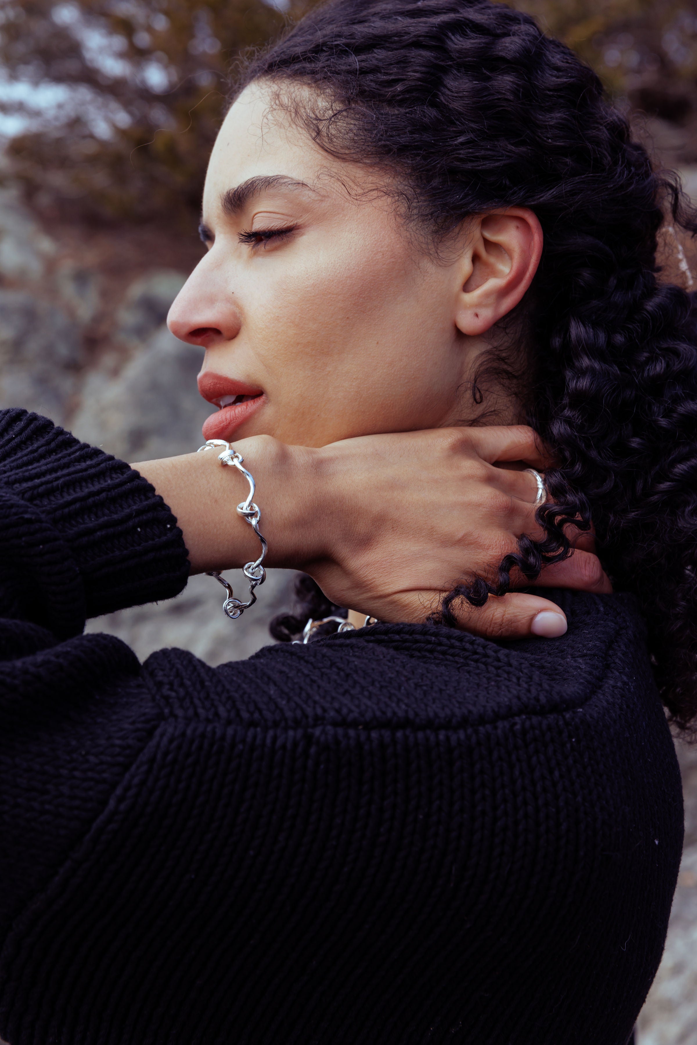 RA HA cast-link chain bracelet in sterling silver, worn on body