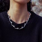 RA HA cast-link chain necklace in sterling silver, worn on body