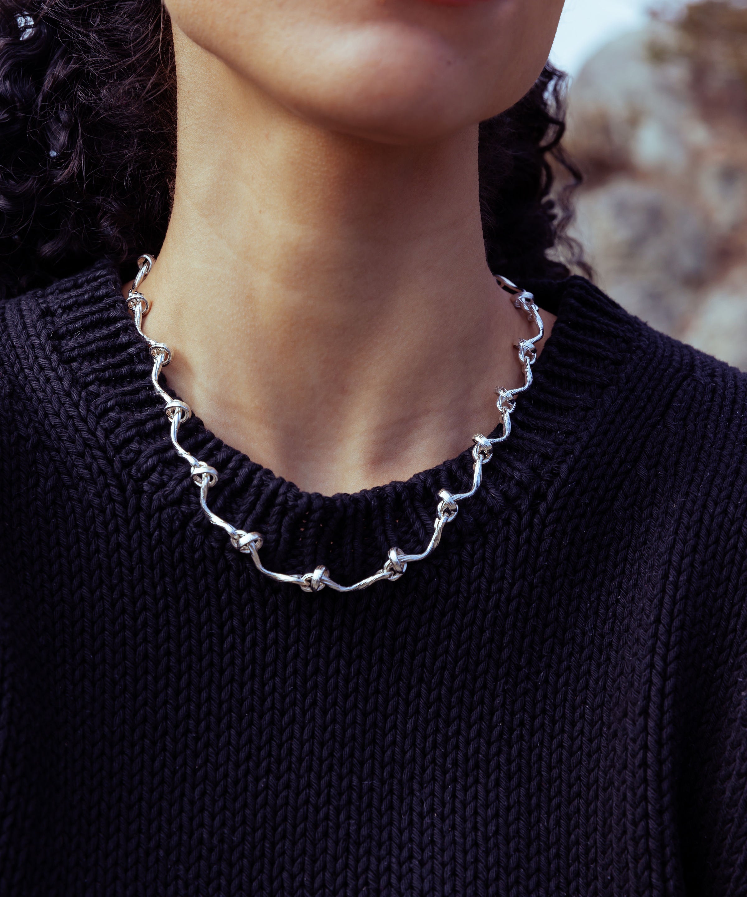 RA HA cast-link chain necklace in sterling silver, worn on body