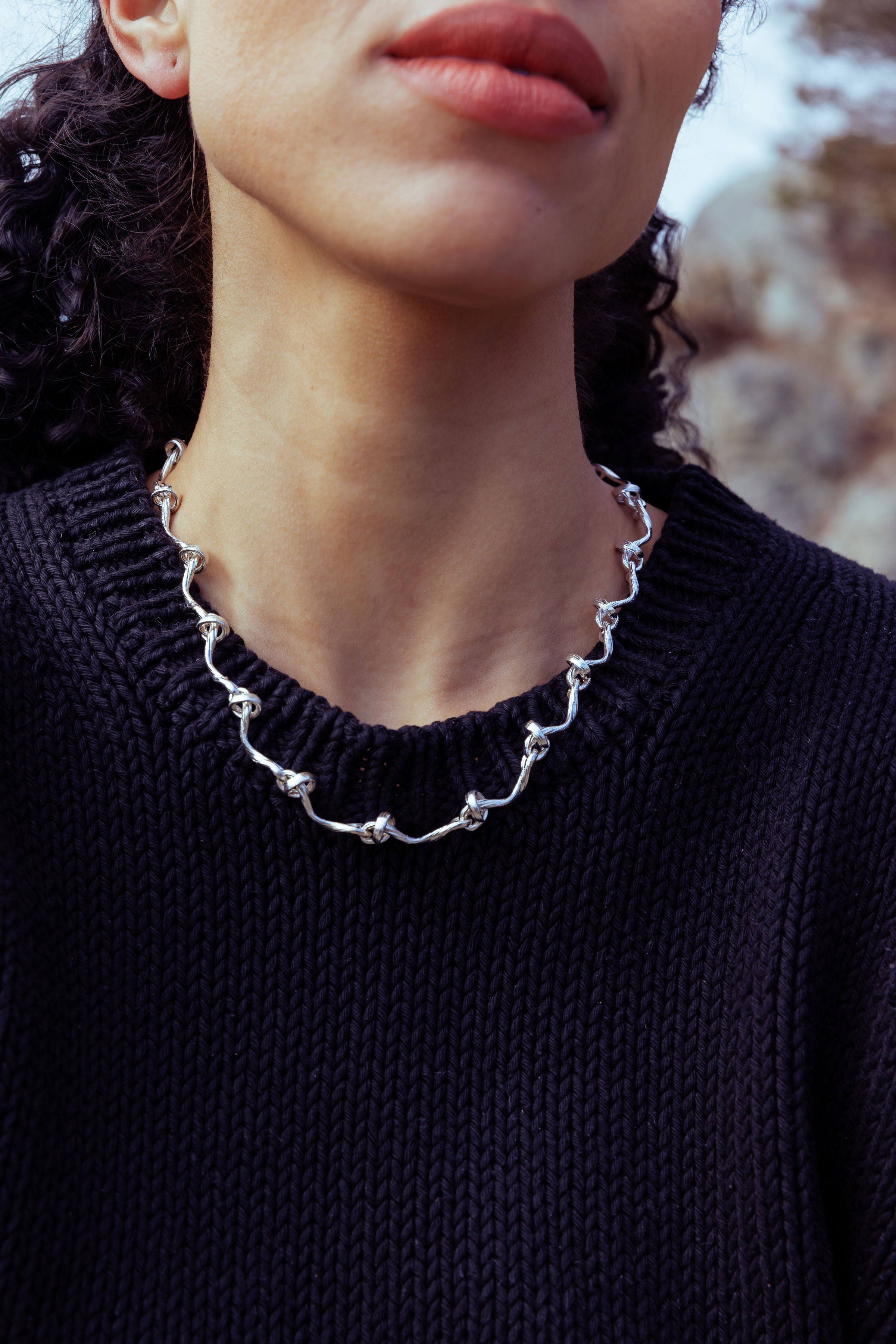 RA HA cast-link chain necklace in sterling silver, worn on body