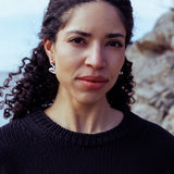 RA HA long sculptural earring in sterling silver, worn on ear
