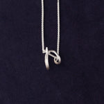 RA HA sculptural pendant necklace in sterling silver from the Continuum collection, front detail view