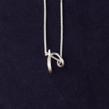 RA HA sculptural pendant necklace in sterling silver from the Continuum collection, front detail view