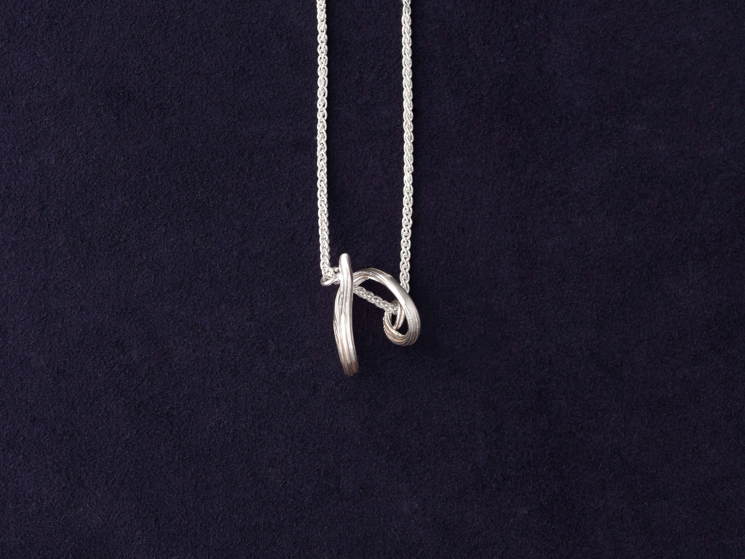 RA HA sculptural pendant necklace in sterling silver from the Continuum collection, front detail view