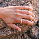 RA HA narrow sculptural ring in sterling silver, worn on hand