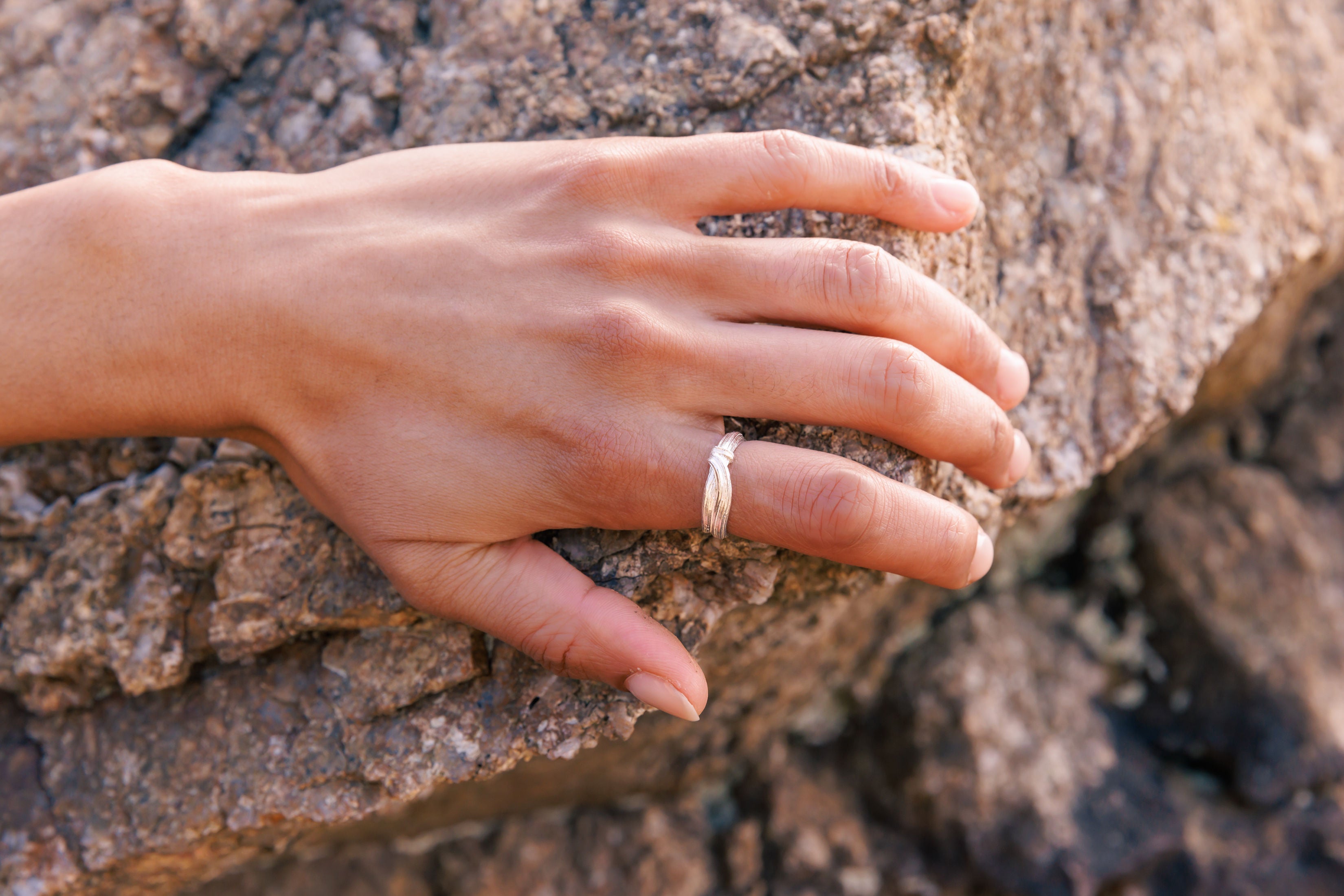 RA HA narrow sculptural ring in sterling silver, worn on hand