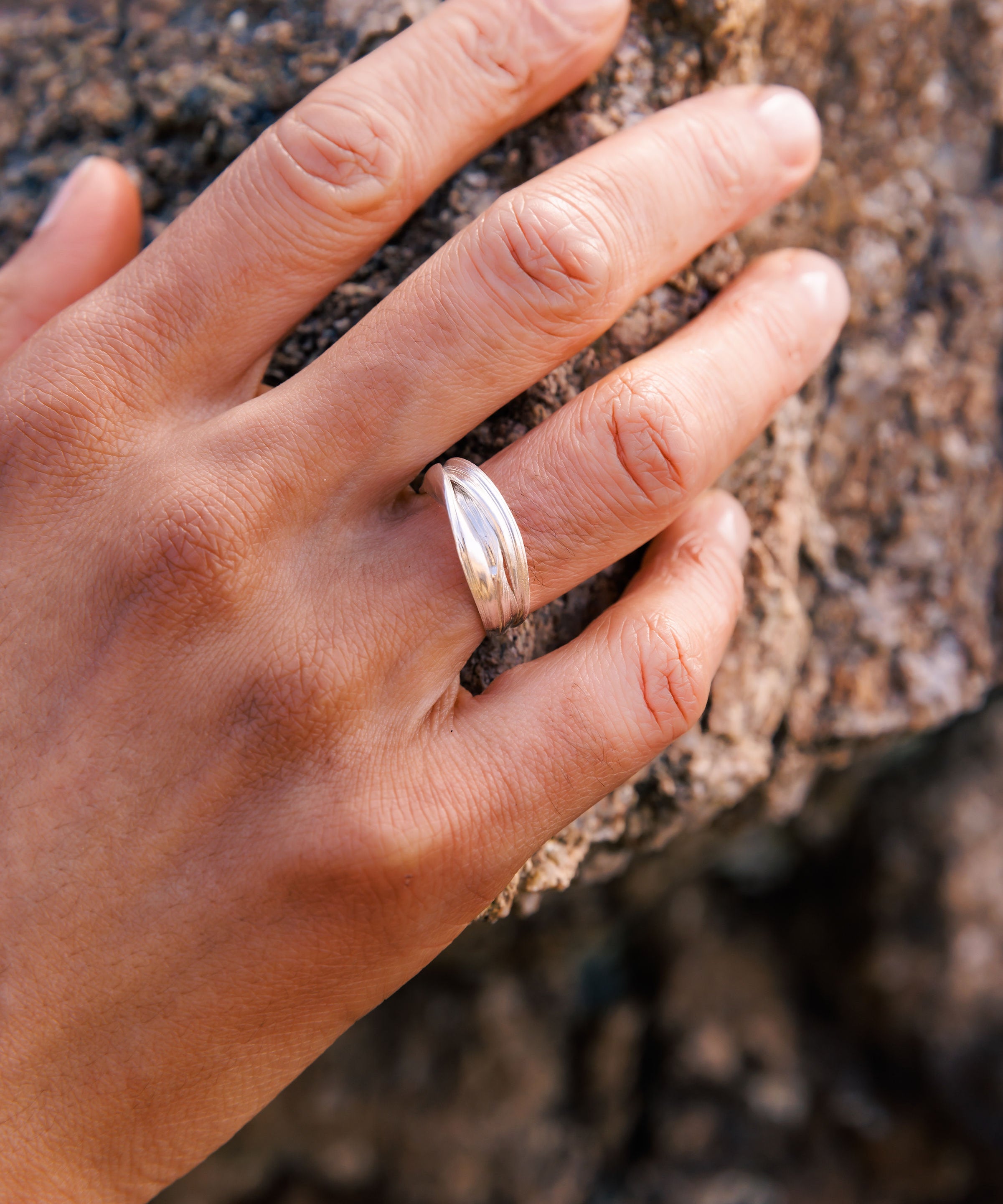 RA HA sculptural ring in sterling silver, worn on hand