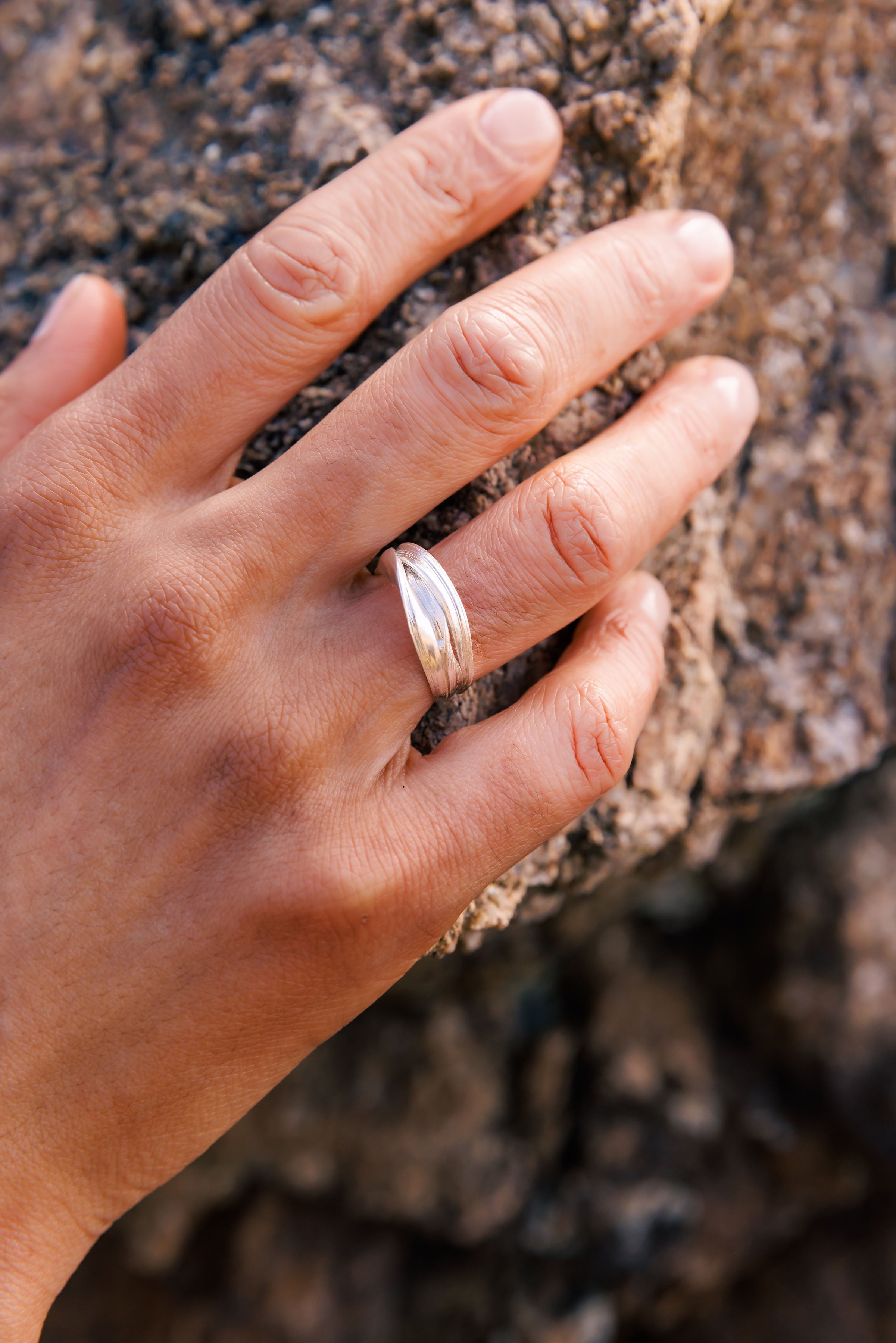 RA HA sculptural ring in sterling silver, worn on hand