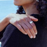 RA HA sculptural ring in sterling silver, worn on hand