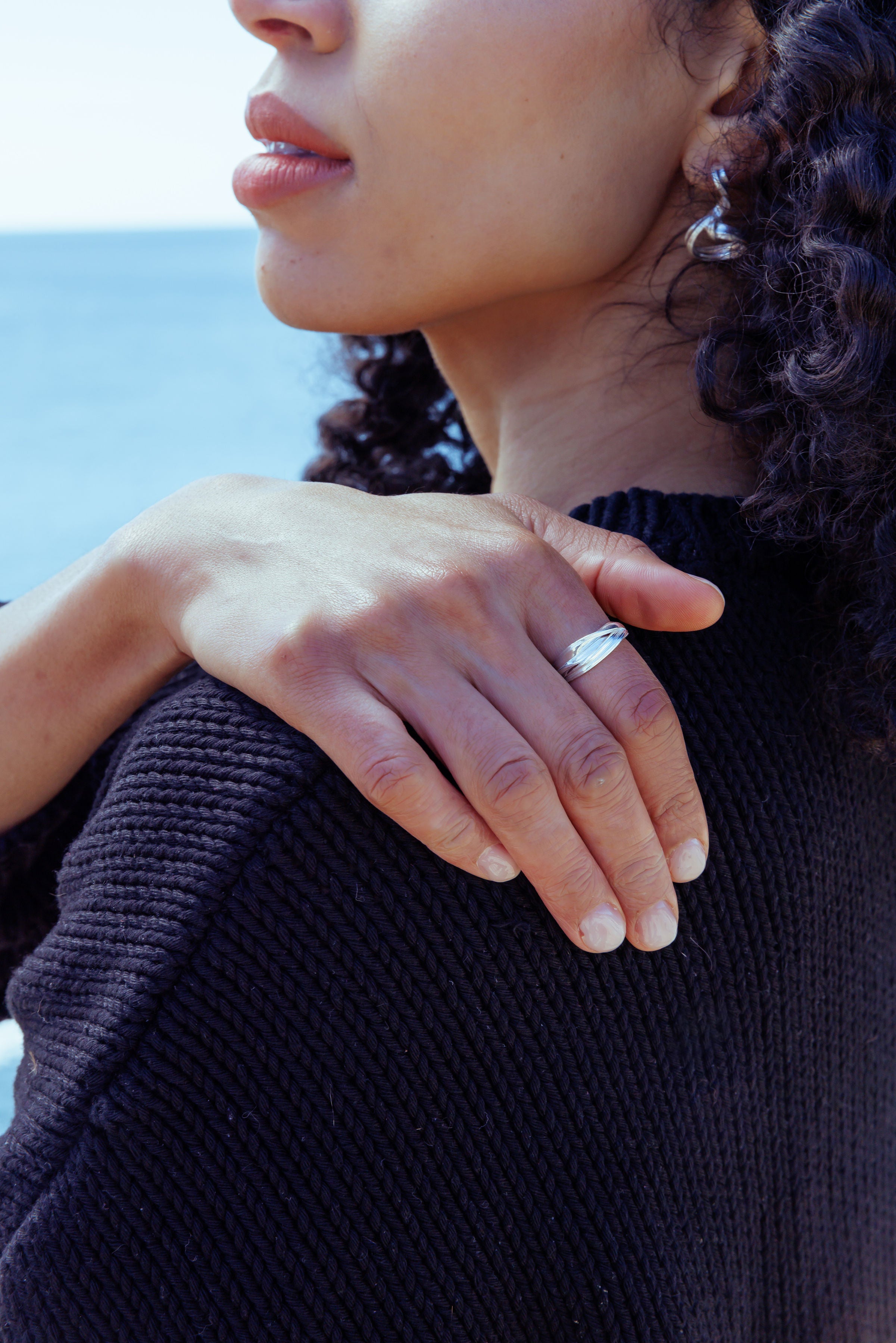 RA HA sculptural ring in sterling silver, worn on hand