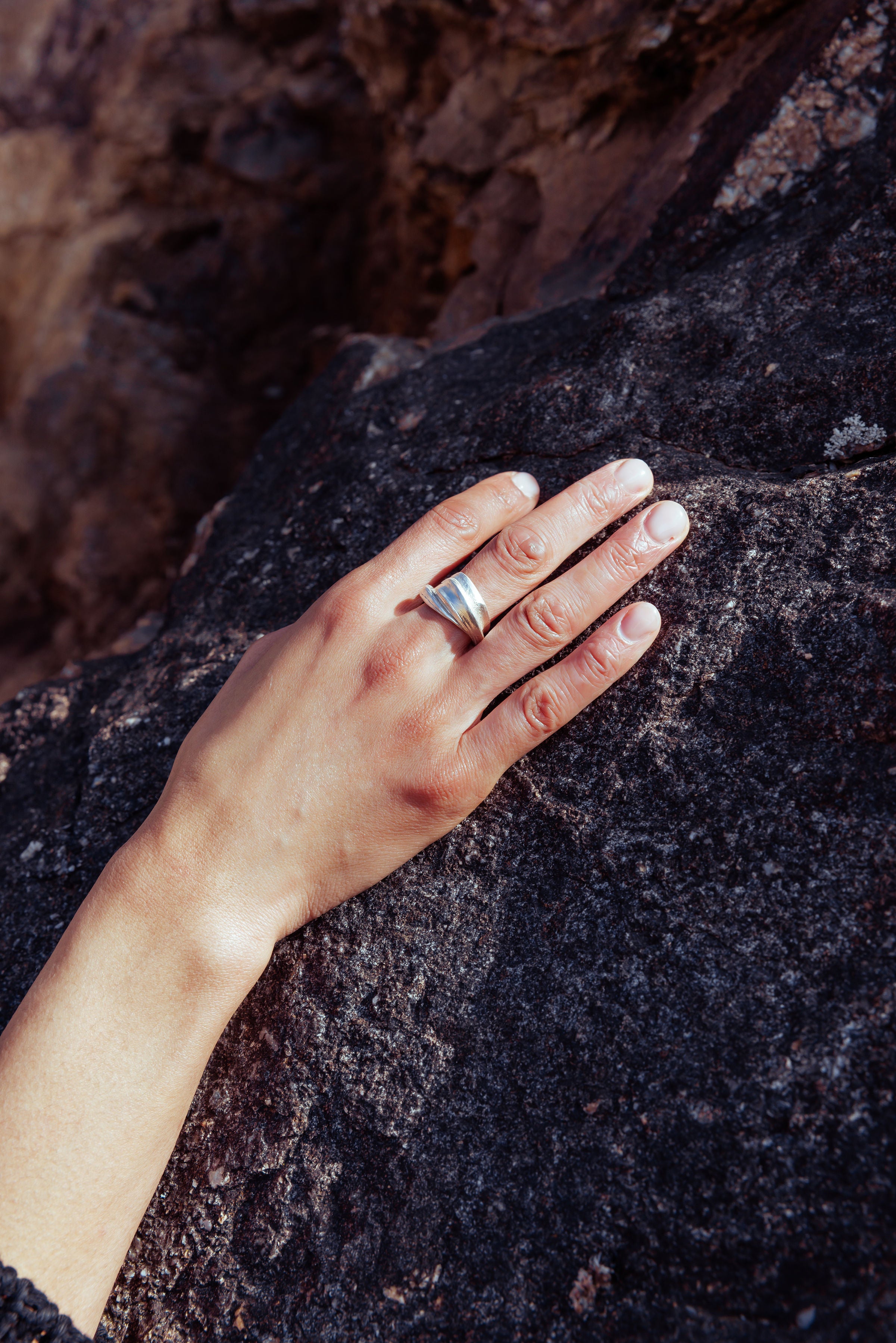 RA HA wide sculptural ring in sterling silver, worn on hand