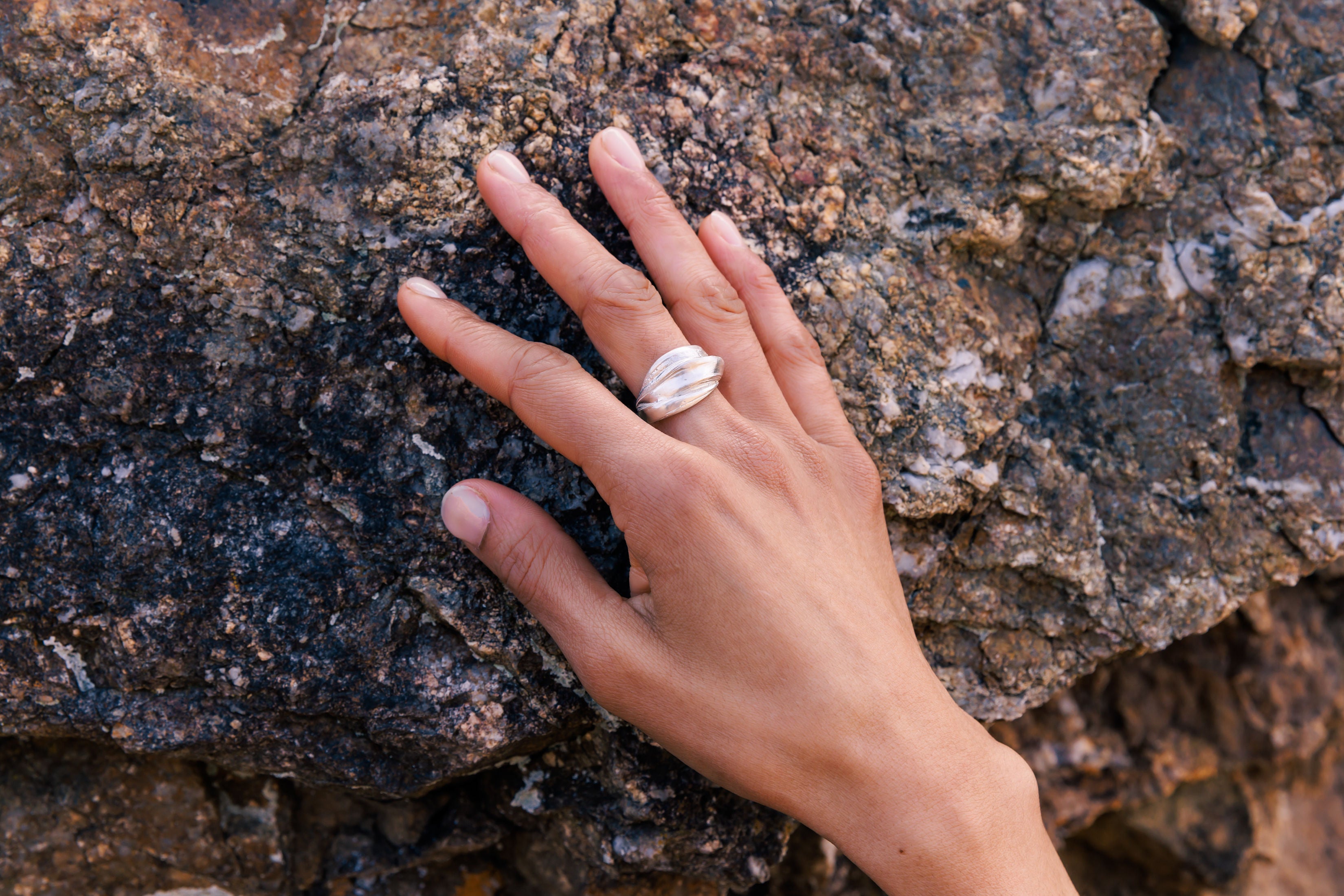 RA HA wide sculptural ring in sterling silver, worn on hand