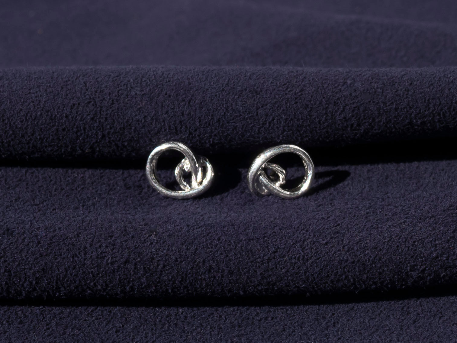 RA HA sculptural stud earrings in sterling silver from the Continuum collection, front view