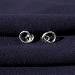 RA HA sculptural stud earrings in sterling silver from the Continuum collection, front view