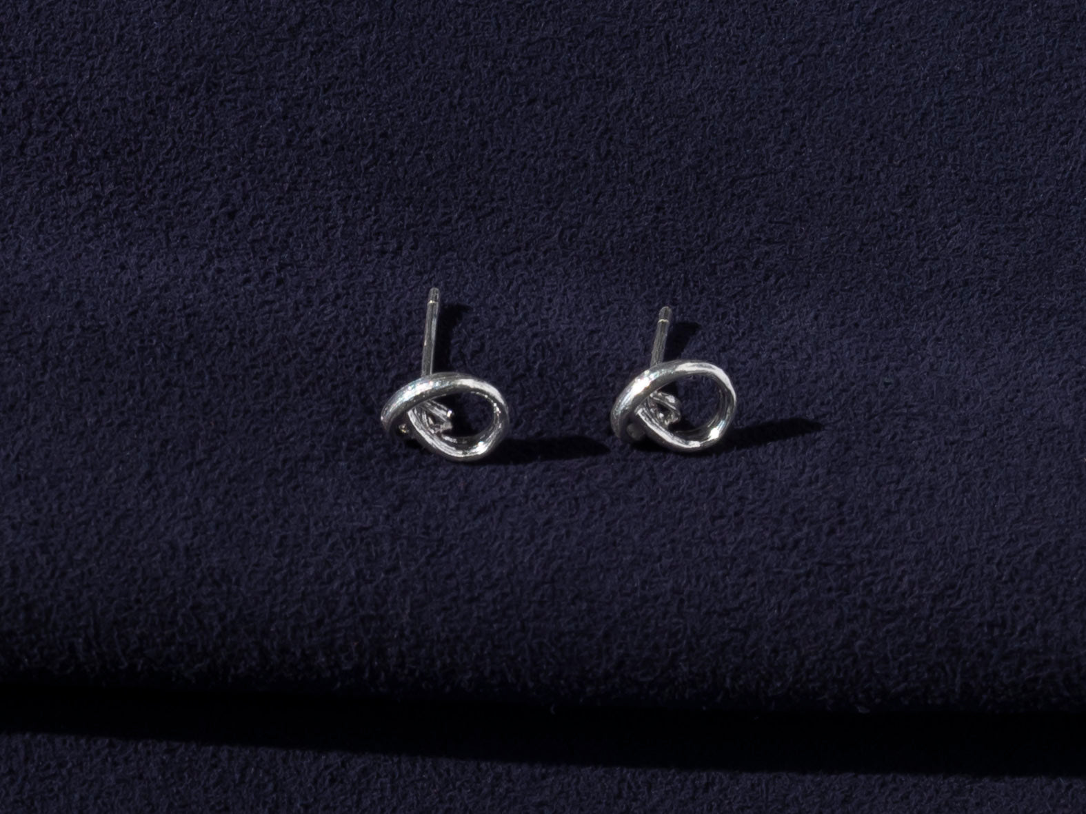 RA HA sculptural stud earrings in sterling silver from the Continuum collection, side view