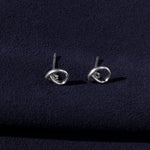RA HA sculptural stud earrings in sterling silver from the Continuum collection, side view